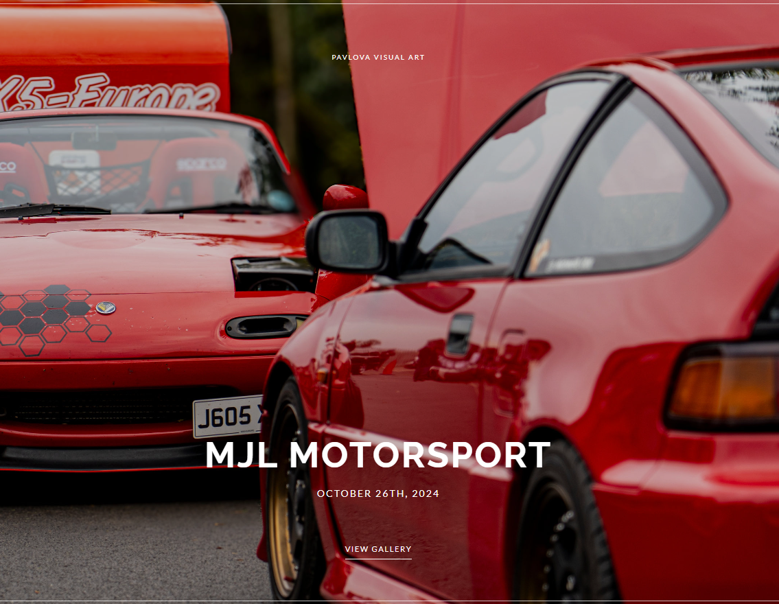 Mazda mx-5 miata parked in front of Honda CRX. both in bright red colours.